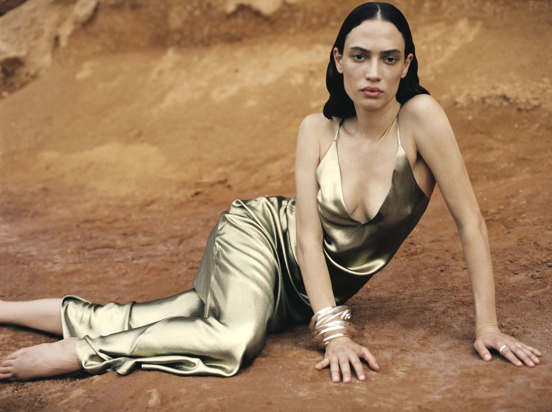 Ibiza production service company photo shoot of a girl in golden dress